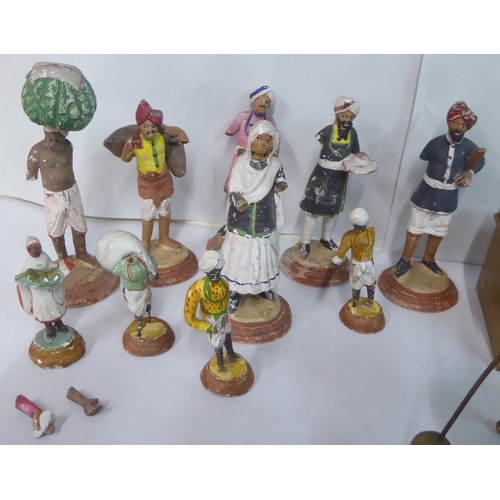 324 - A mixed lot: to include 20thC Indian clay figures  all approx. 5