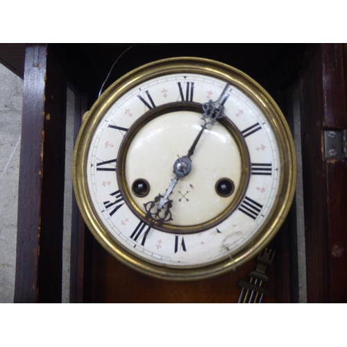 328 - A late 19thC stained beech cased wall timepiece; the movement faced by a Roman dial  32