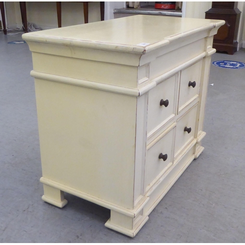 329 - A modern shabby chic painted inverted breakfront, four drawer cabinet, on a plinth  24