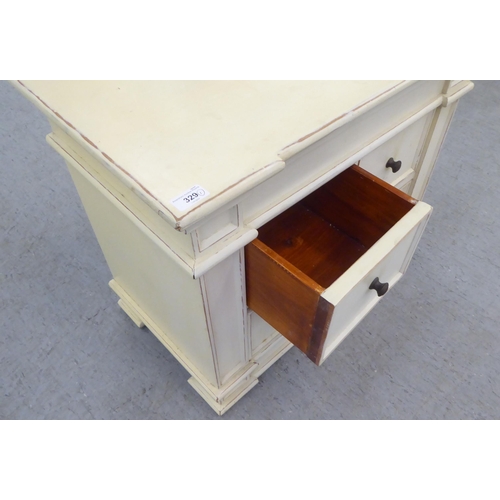 329 - A modern shabby chic painted inverted breakfront, four drawer cabinet, on a plinth  24