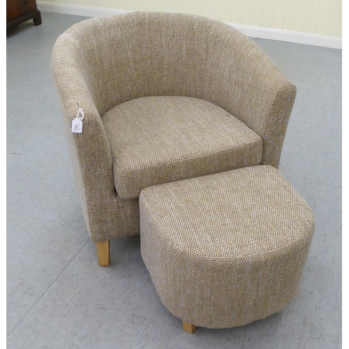 333 - A modern three tone textured, fabric upholstered tub chair and footstool, raised on tapered forelegs