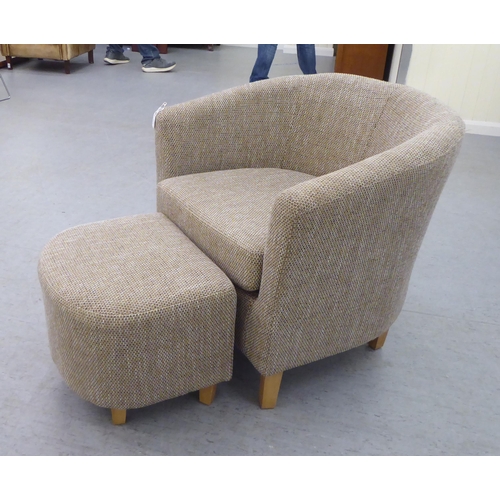 333 - A modern three tone textured, fabric upholstered tub chair and footstool, raised on tapered forelegs