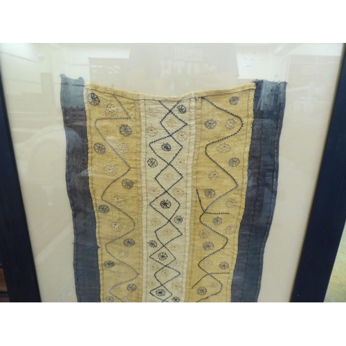 334 - A (possibly African) framed textile  21