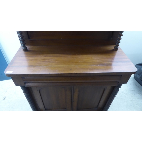 340 - A late Victorian mahogany chiffonier with a raised back, over a drawer and two panelled doors, on a ... 