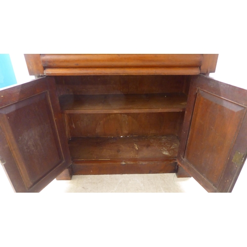 340 - A late Victorian mahogany chiffonier with a raised back, over a drawer and two panelled doors, on a ... 