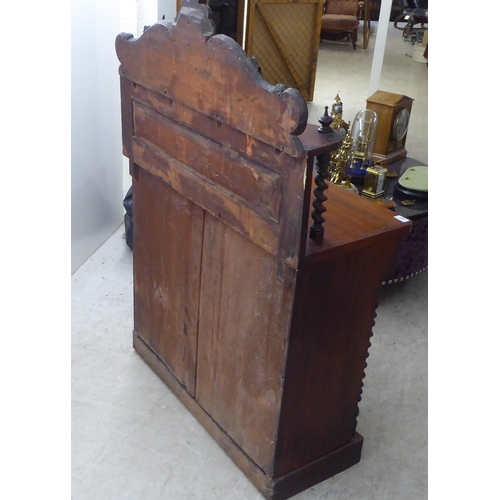 340 - A late Victorian mahogany chiffonier with a raised back, over a drawer and two panelled doors, on a ... 