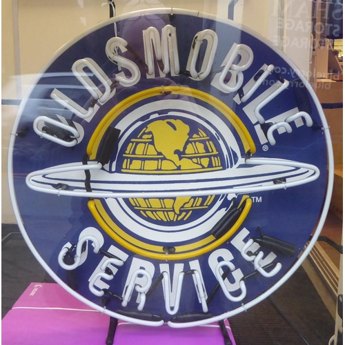 342 - A neon sign 'Oldsmobile Service'  23