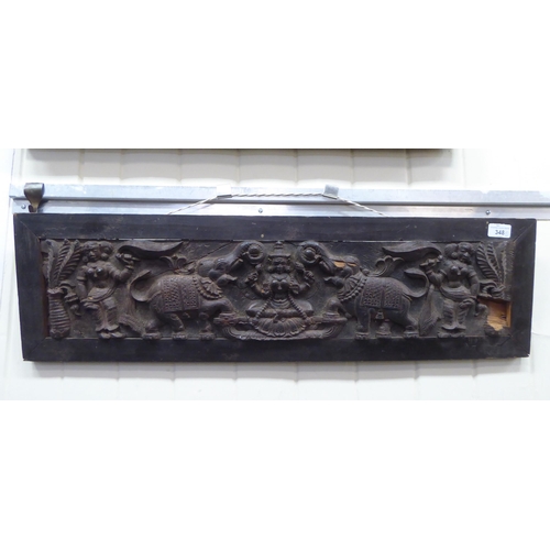 348 - A late 19thC Indian hardwood panel, carved with elephants and figures  7