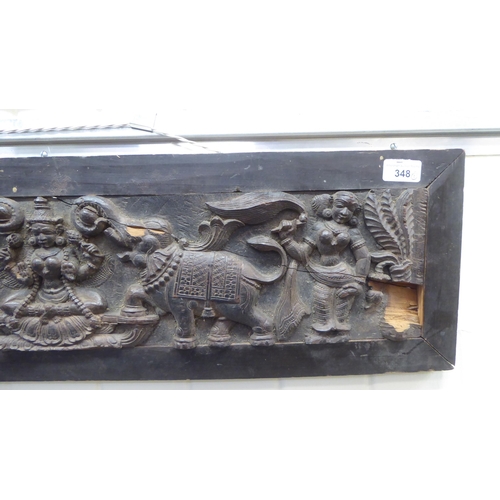 348 - A late 19thC Indian hardwood panel, carved with elephants and figures  7