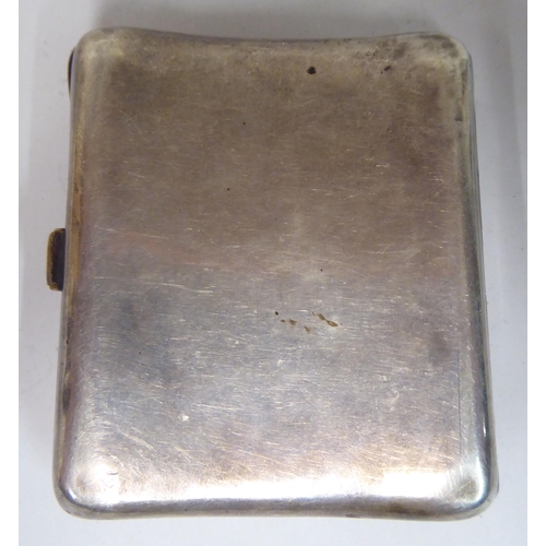 45 - A silver folding cigarette case, on a button clasp, decorated in Art Nouveau taste, coloured enamel ... 