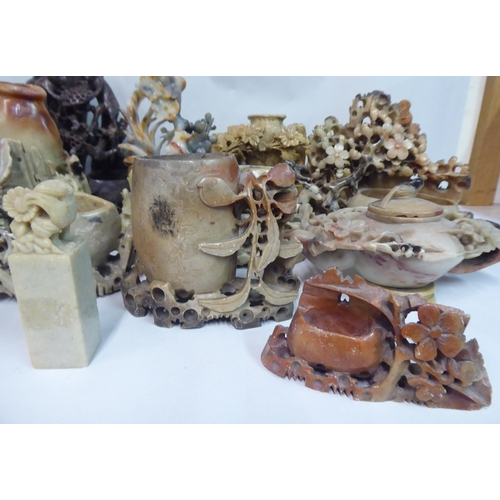 49 - 20thC carved Oriental soapstone ornaments: to include landscapes, birds and vases  mixed sizes