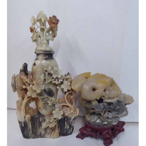 49 - 20thC carved Oriental soapstone ornaments: to include landscapes, birds and vases  mixed sizes