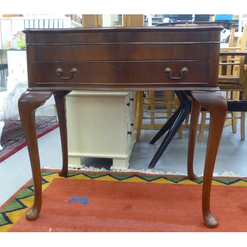 69 - A modern mahogany (empty) table canteen with a hinged serpentine front lid, over two fabric lined, f... 