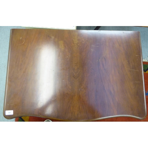 69 - A modern mahogany (empty) table canteen with a hinged serpentine front lid, over two fabric lined, f... 