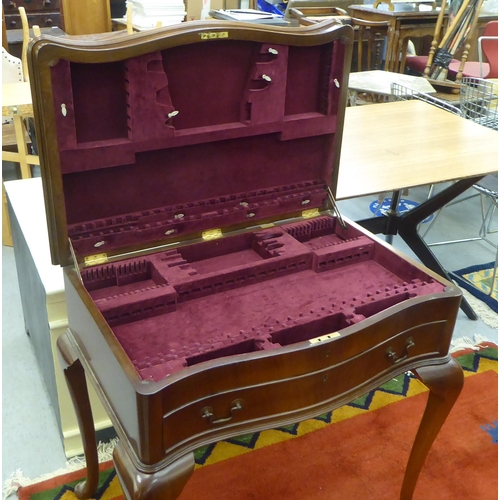 69 - A modern mahogany (empty) table canteen with a hinged serpentine front lid, over two fabric lined, f... 