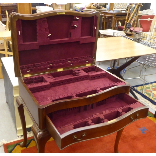 69 - A modern mahogany (empty) table canteen with a hinged serpentine front lid, over two fabric lined, f... 