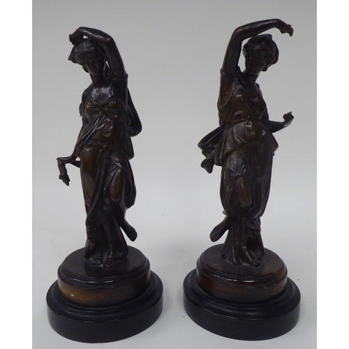 16 - Late 19thC French spelter models, each featuring a dancing maiden, on a turned plinth, viz. a pair a... 