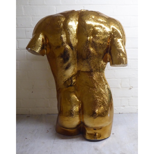 75 - A gold painted plaster sculpture, a nude male torso  29