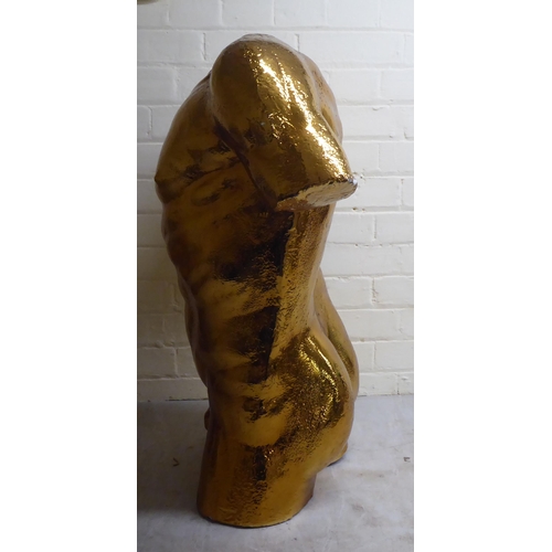 75 - A gold painted plaster sculpture, a nude male torso  29