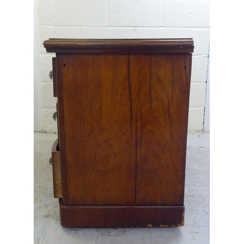 78 - A late Victorian one-piece mahogany bow breakfront, six drawer kneehole desk, on a plinth  29