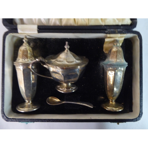 79 - A four piece silver condiments set  boxed  Sheffield 1951