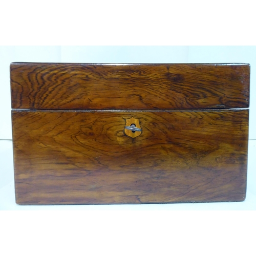 81 - A late Victorian rosewood vanity box with a hinged lid, enclosing a part-fitted interior and a base ... 