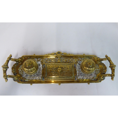 88 - Metalware: to include a late Victorian brass deskstand with two glass inkwells  8