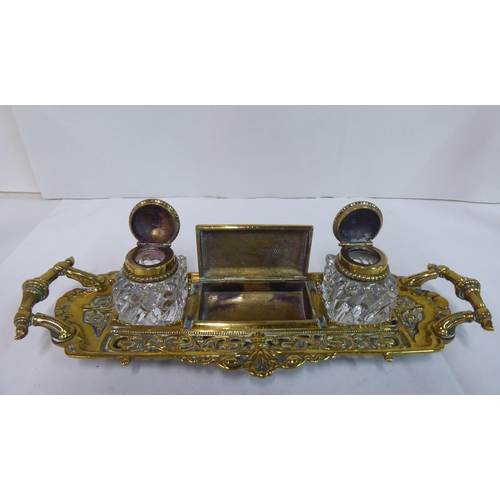 88 - Metalware: to include a late Victorian brass deskstand with two glass inkwells  8