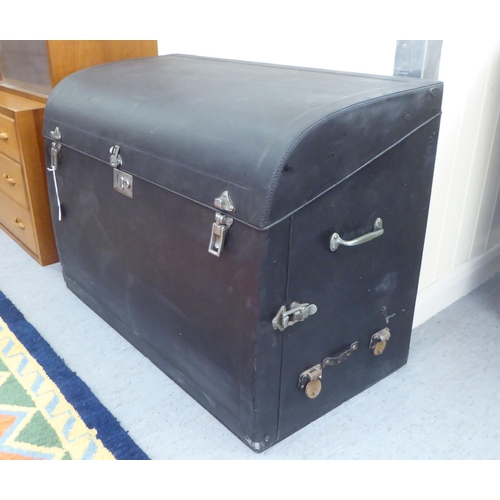 95 - A Vintage Brooks ebonised car trunk (unfitted) with straight sides and a hinged lid, on a plinth  23... 