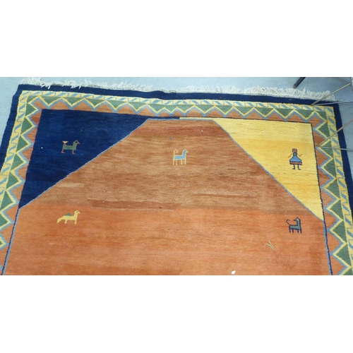 99 - A modern woollen rug, decorated with animals on a two-tone orange/red ground  102