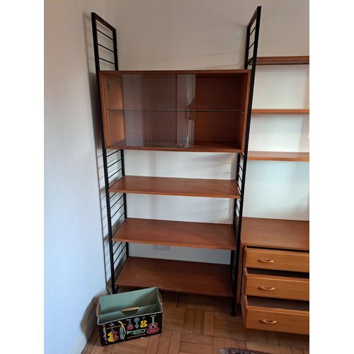 219 - A Staples Ladderax modular triple section livingroom unit, comprising an arrangement of cabinets and... 