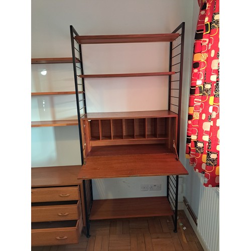 219 - A Staples Ladderax modular triple section livingroom unit, comprising an arrangement of cabinets and... 