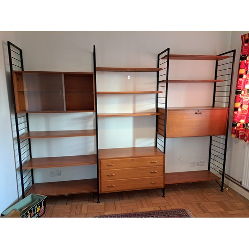 219 - A Staples Ladderax modular triple section livingroom unit, comprising an arrangement of cabinets and... 