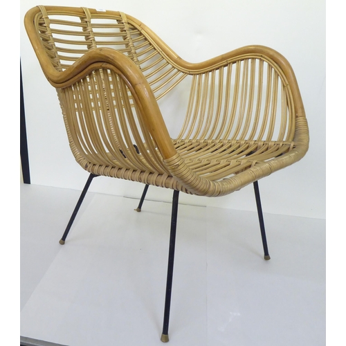 108 - A mid century bamboo and woven cane chair, raised on wrought metal legs