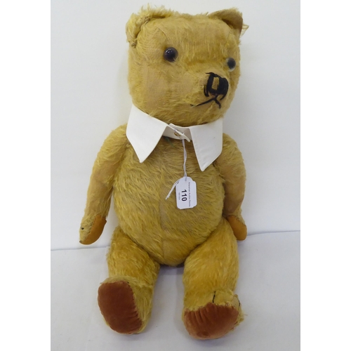 110 - Toys: to include a Teddy bear, in gold mohair with mobile limbs  21