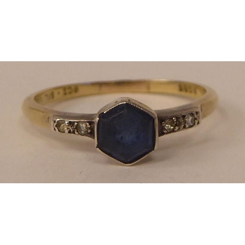 129 - A 9ct gold and white metal ring, set with a central, hexagonal sapphire