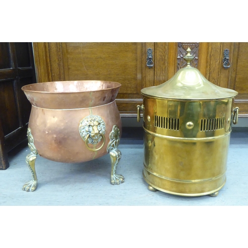 139 - Decorative and functional copperware: to include a log bucket, decorated with lion mask handles and ... 