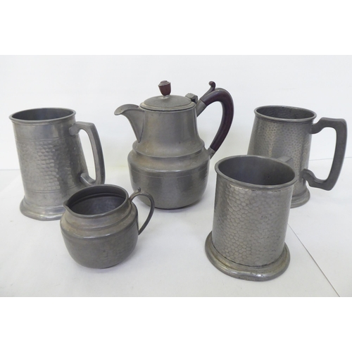 172 - Pewter collectables, viz. three tankards; a teapot; a milk jug; and a plate  15