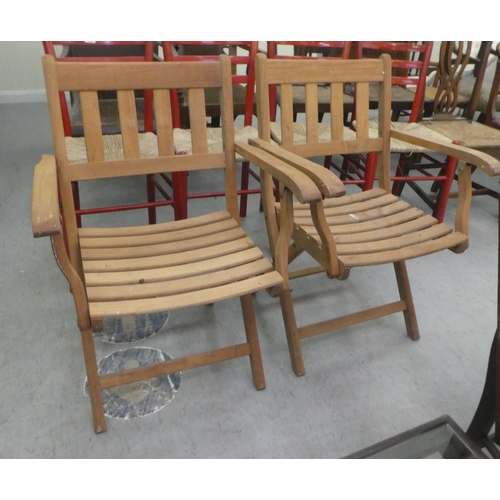 188 - A pair of Lister teak folding garden chairs