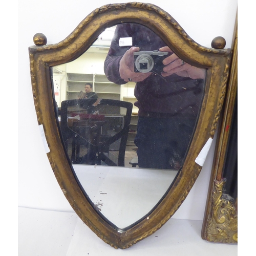 196 - Mirrors: to include a late Victorian shield shaped example, in a gilt frame  17