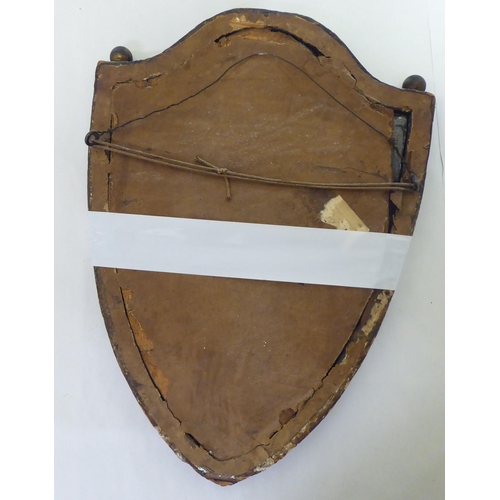 196 - Mirrors: to include a late Victorian shield shaped example, in a gilt frame  17