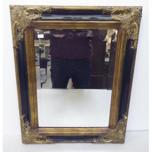 196 - Mirrors: to include a late Victorian shield shaped example, in a gilt frame  17