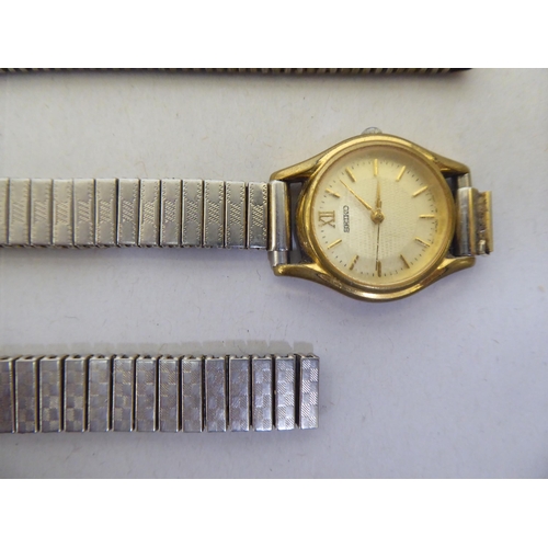 221 - Wristwatches: to include a Seiko 5 automatic bracelet watch, faced by a baton dial