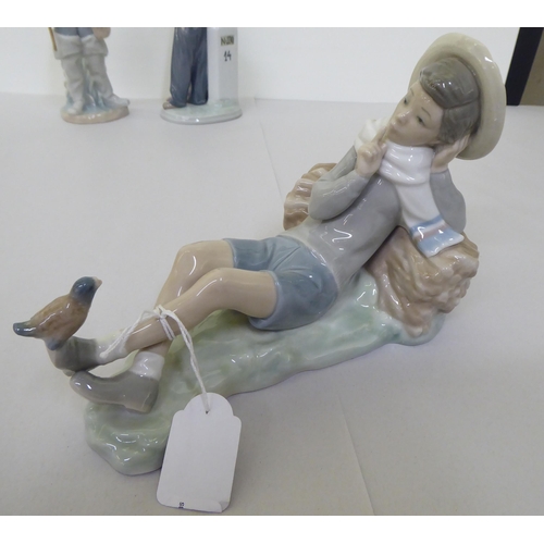 223 - Four Lladro figures: to include a young boy holding a fishing rod  9