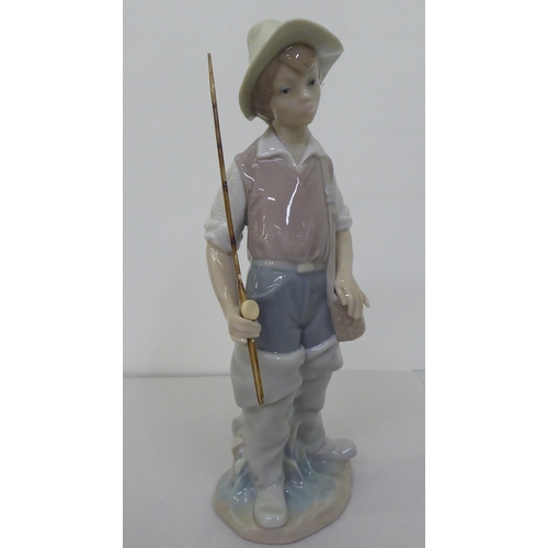 223 - Four Lladro figures: to include a young boy holding a fishing rod  9