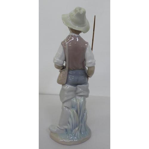 223 - Four Lladro figures: to include a young boy holding a fishing rod  9