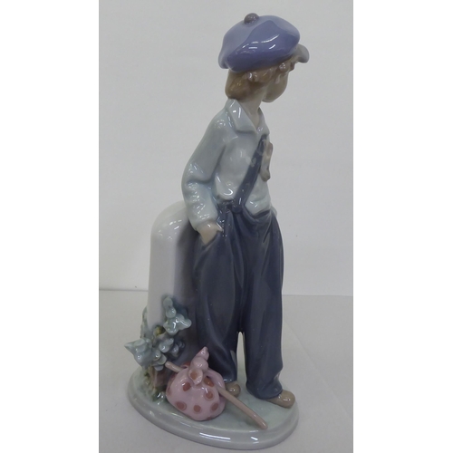 223 - Four Lladro figures: to include a young boy holding a fishing rod  9