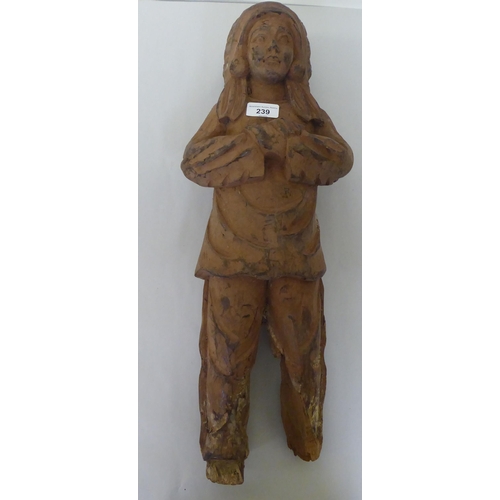 239 - A modern carved wooden figure, a native American  23.5