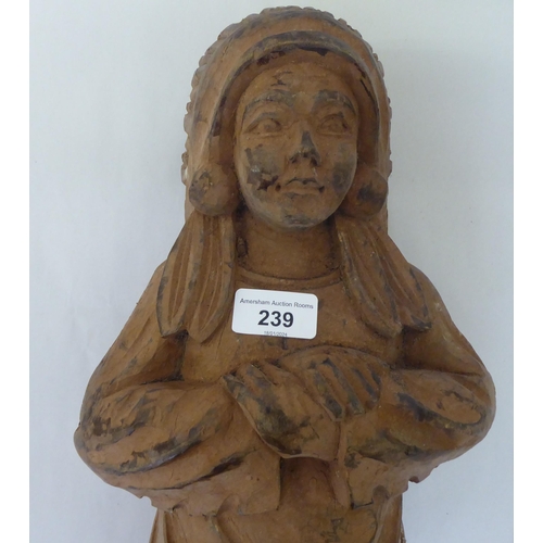 239 - A modern carved wooden figure, a native American  23.5