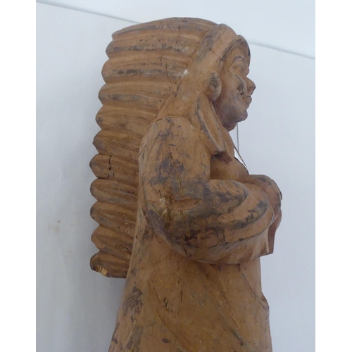 239 - A modern carved wooden figure, a native American  23.5